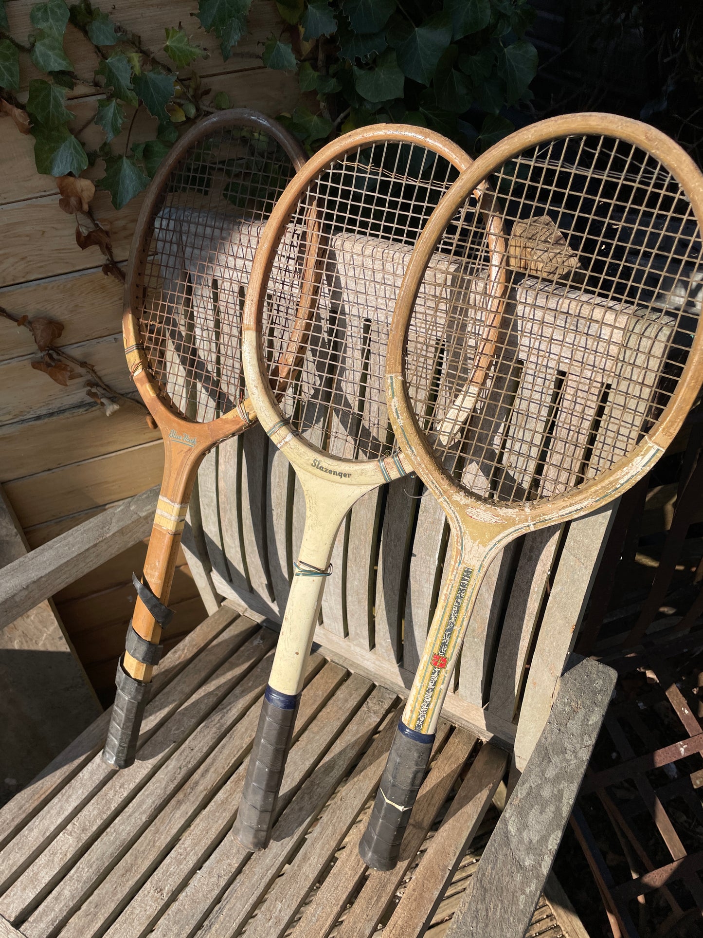 Three vintage wooden tennis rackets Slazenger Royal Crown, Dunlop Blue Flash and an international British one