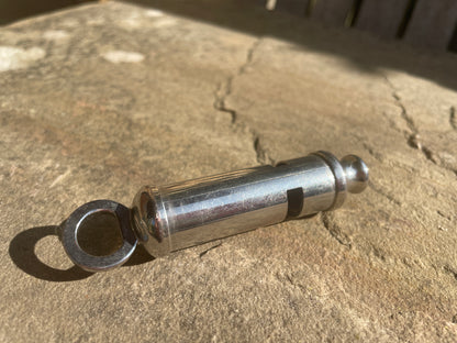 WW1 1916 antique trench whistle dated and marked with the army broad arrow mark