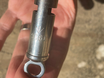 WW1 1916 antique trench whistle dated and marked with the army broad arrow mark
