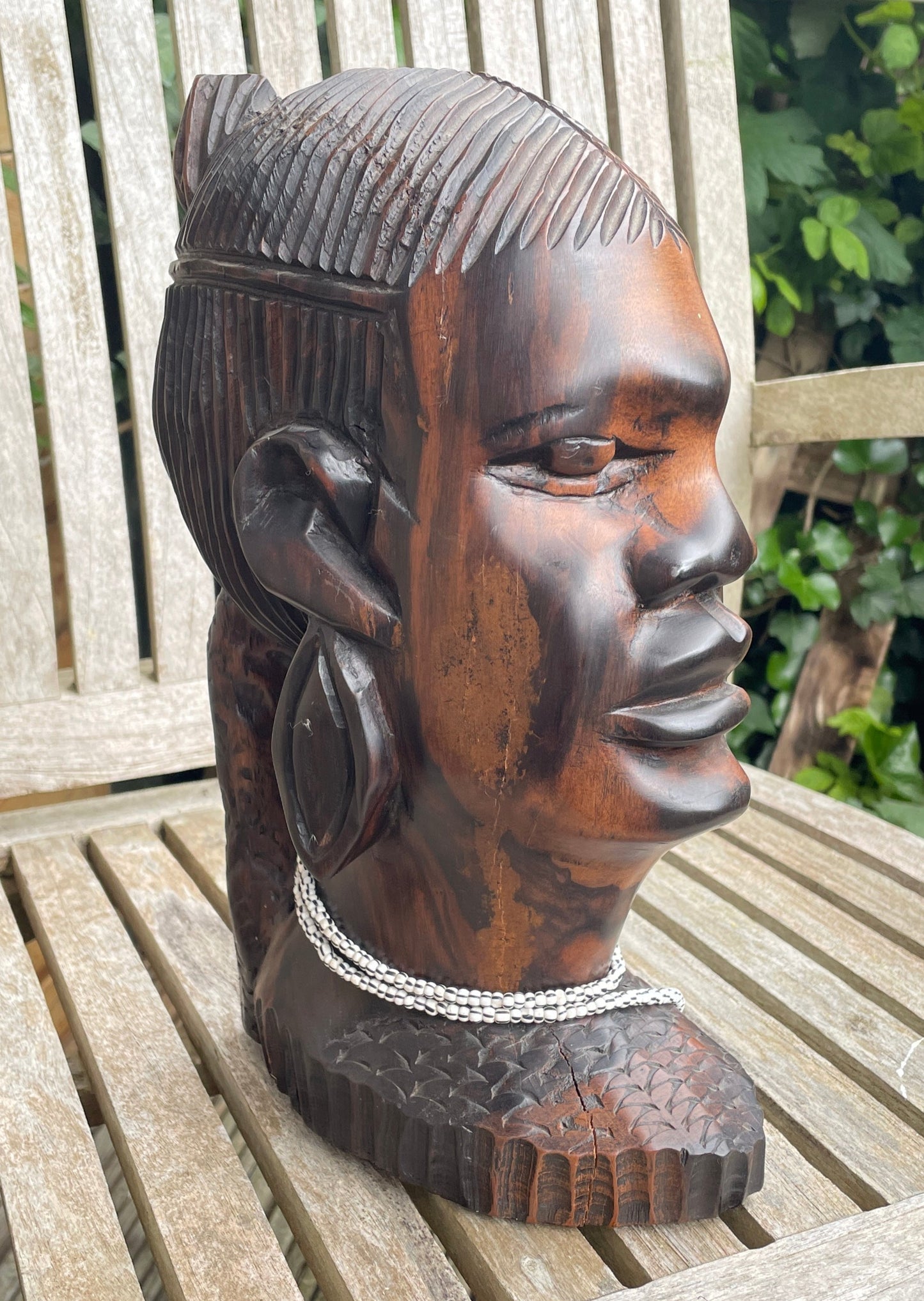 A substantial African hard wood carving of a female's head