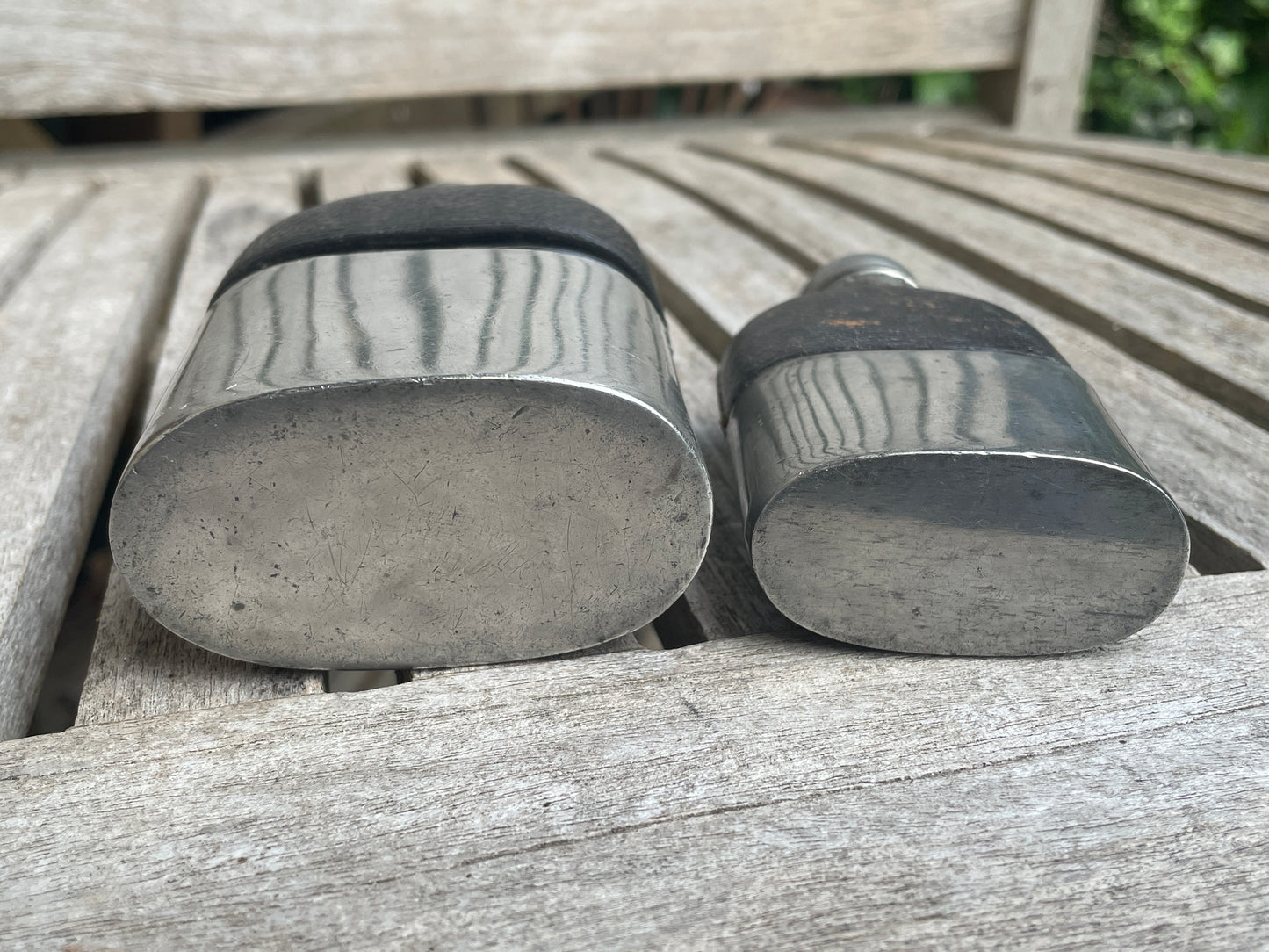 Pair of Vintage Leather & Metal Hip Flasks – Travel Companion Bottles with Removable Cups, Early to Mid 20th Century