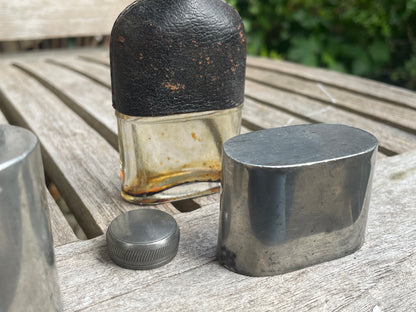 Pair of Vintage Leather & Metal Hip Flasks – Travel Companion Bottles with Removable Cups, Early to Mid 20th Century