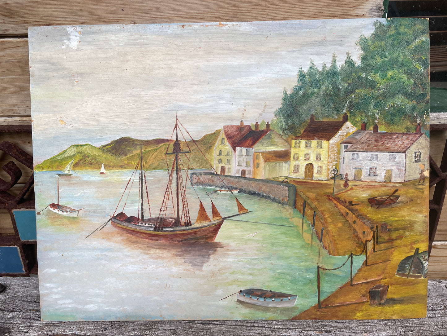 Naïve folk art oil on board painting of an English Harbour