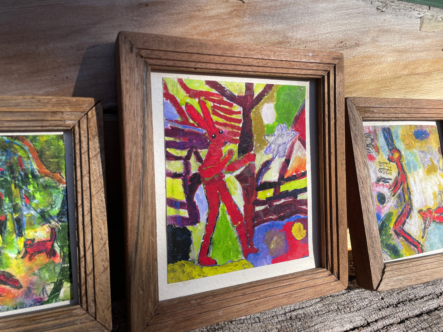 Three small framed original artworks by Tom Lywood to illustrate his poems