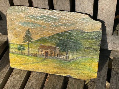 Hand painted unique folk art painting of a Welsh cottage inscribed 'Bwthyn Bach to Gwelt' on slate