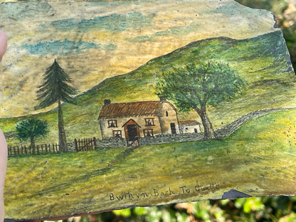 Hand painted unique folk art painting of a Welsh cottage inscribed 'Bwthyn Bach to Gwelt' on slate