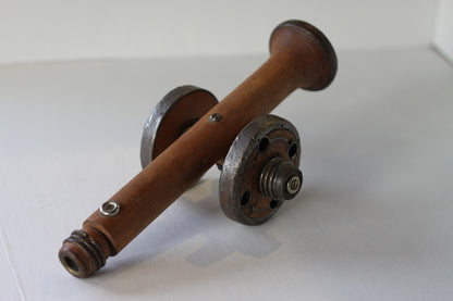 A Folk art model of a Cannon made from Antique Bobbins and Pins from The Pennines.