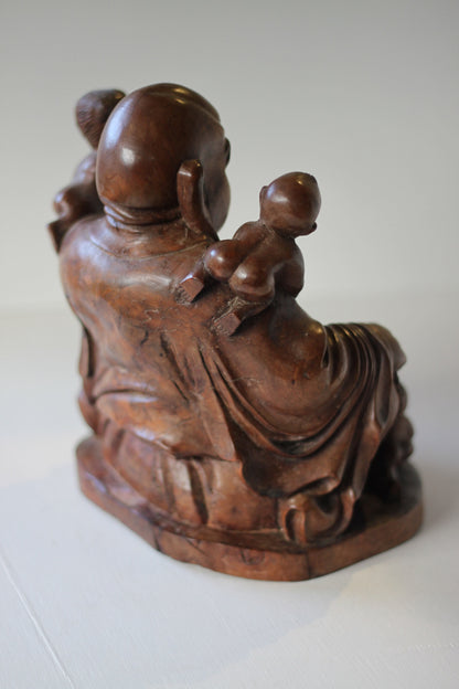 A Chinese, hand carved, unique wood Group of Budai and five infants