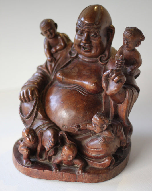 A Chinese, hand carved, unique wood Group of Budai and five infants