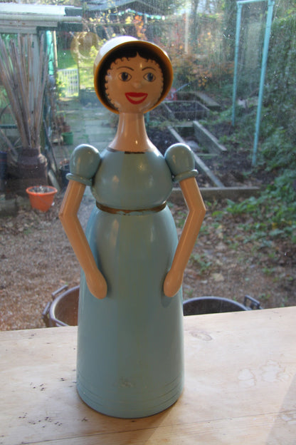 A hand turned and painted Folk Art, wood figure of Aunt Sally by Michael Powell