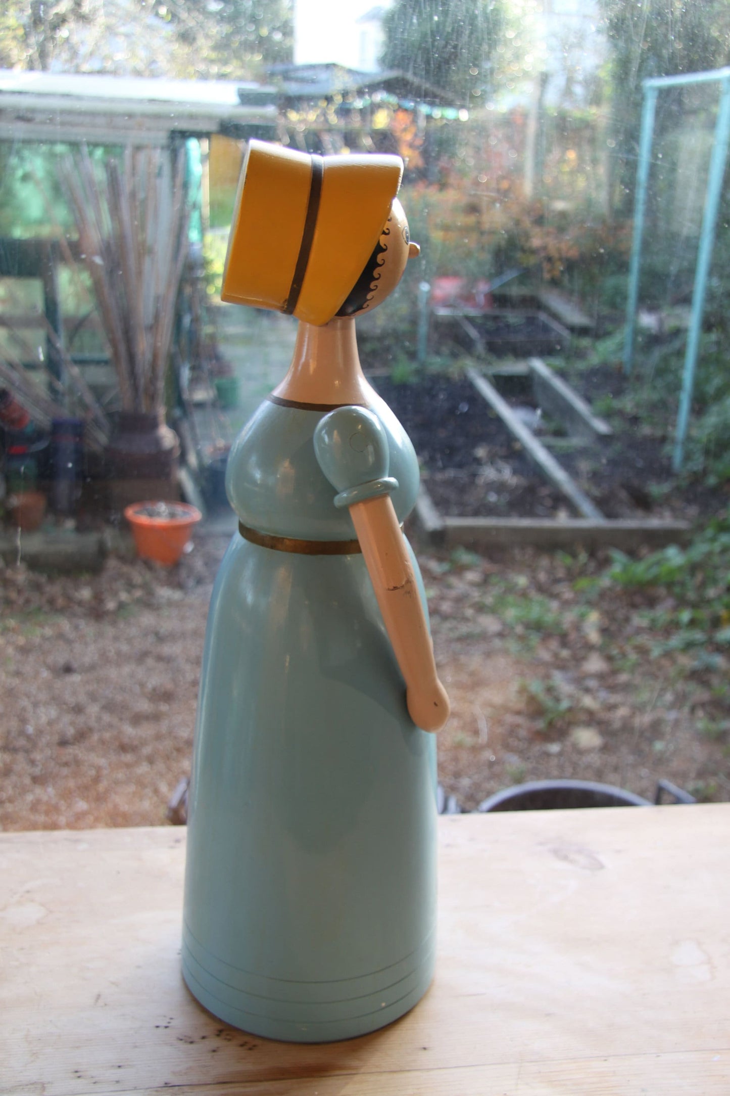 A hand turned and painted Folk Art, wood figure of Aunt Sally by Michael Powell