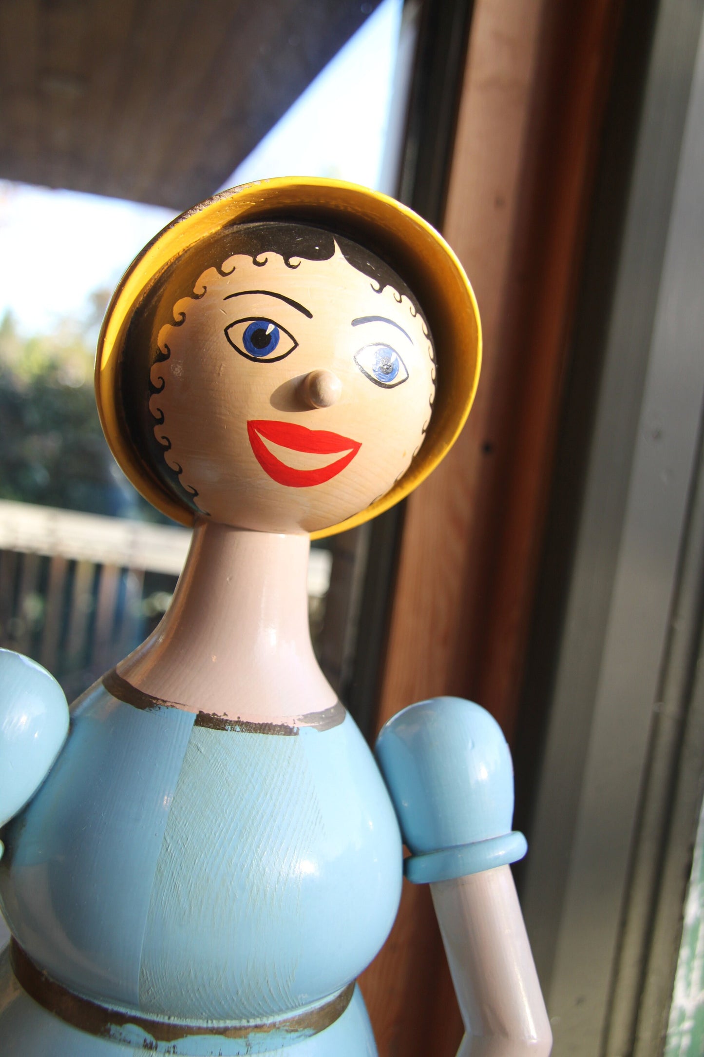 A hand turned and painted Folk Art, wood figure of Aunt Sally by Michael Powell