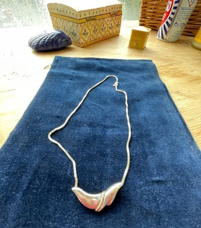 A Danish Sterling Silver Pendant and 925 Lund Necklace weighs 8g