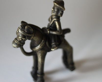 Cast brass of an Indian figure on a horse