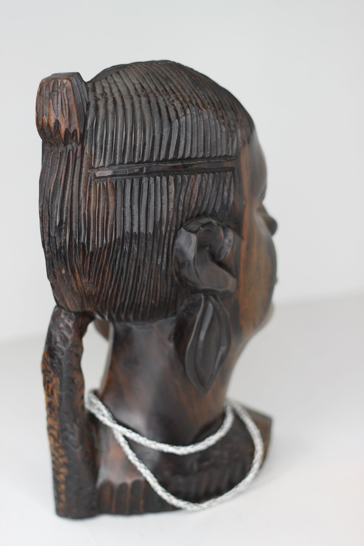 A substantial African hard wood carving of a female's head