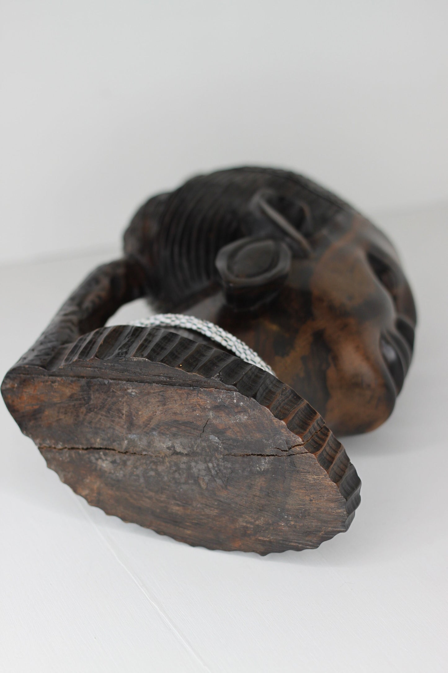 A substantial African hard wood carving of a female's head