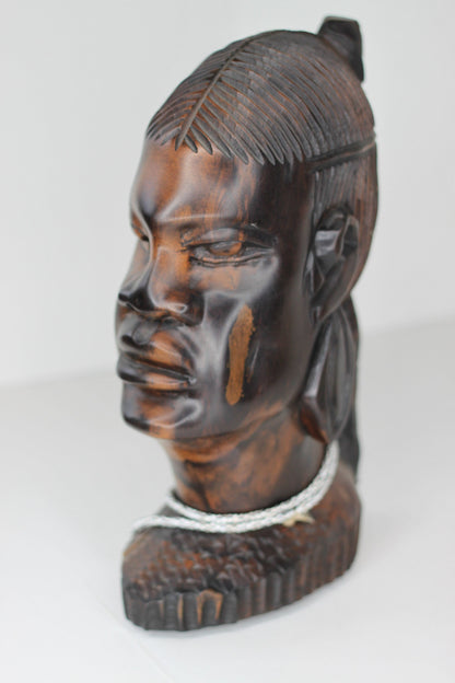 A substantial African hard wood carving of a female's head