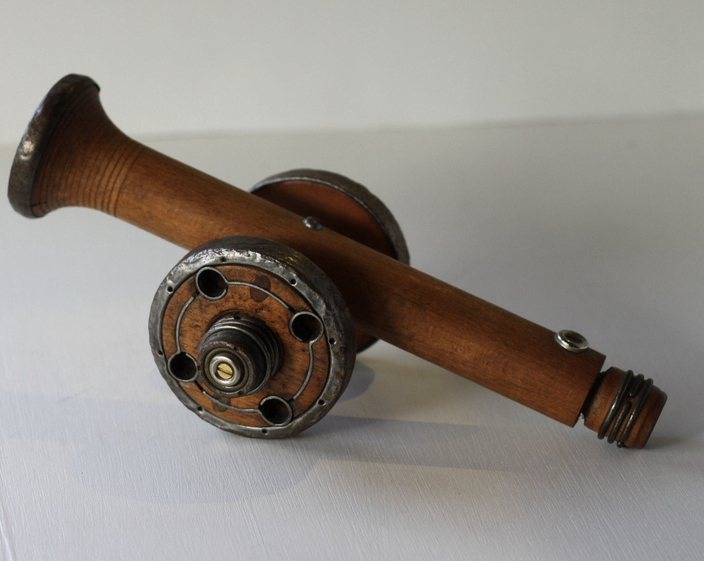 A Folk art model of a Cannon made from Antique Bobbins and Pins from The Pennines.