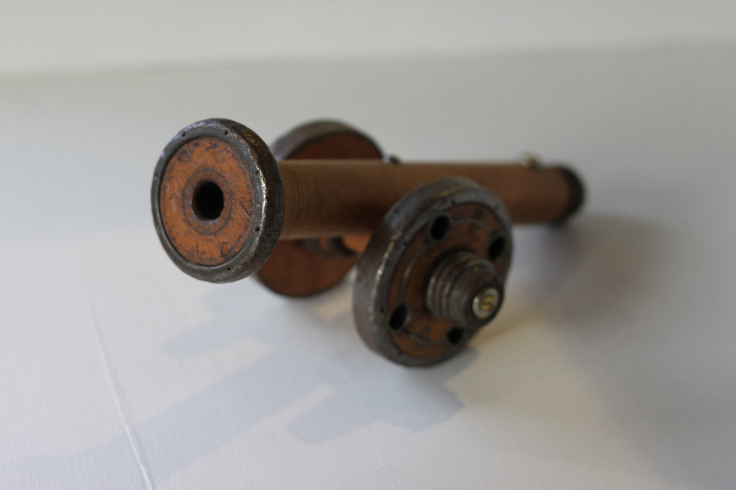 A Folk art model of a Cannon made from Antique Bobbins and Pins from The Pennines.