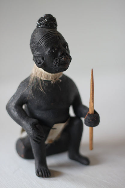 An Original Hand Made One Off Pottery Tribal Figurine in Traditional Dress and With Spear