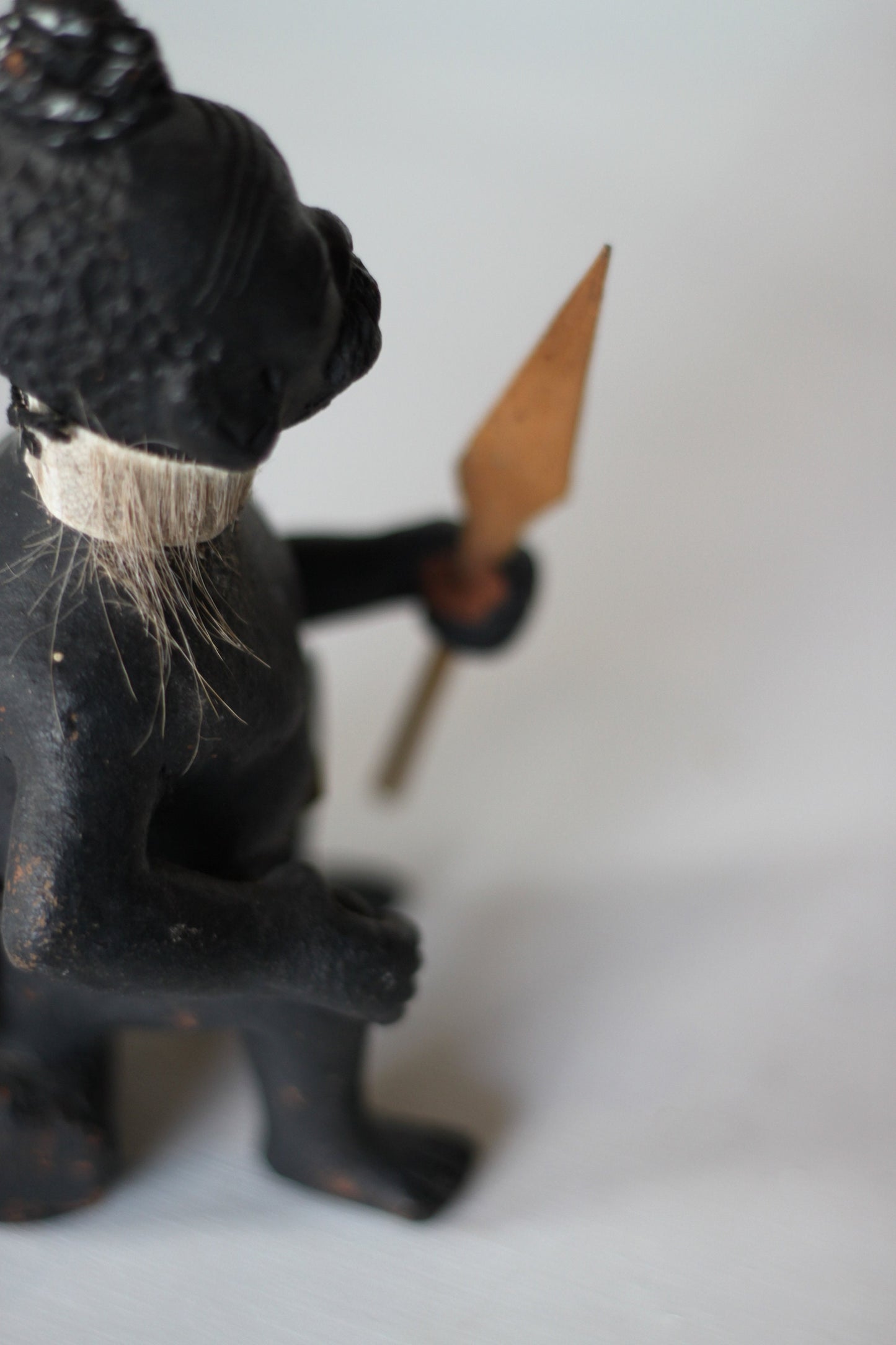 An Original Hand Made One Off Pottery Tribal Figurine in Traditional Dress and With Spear