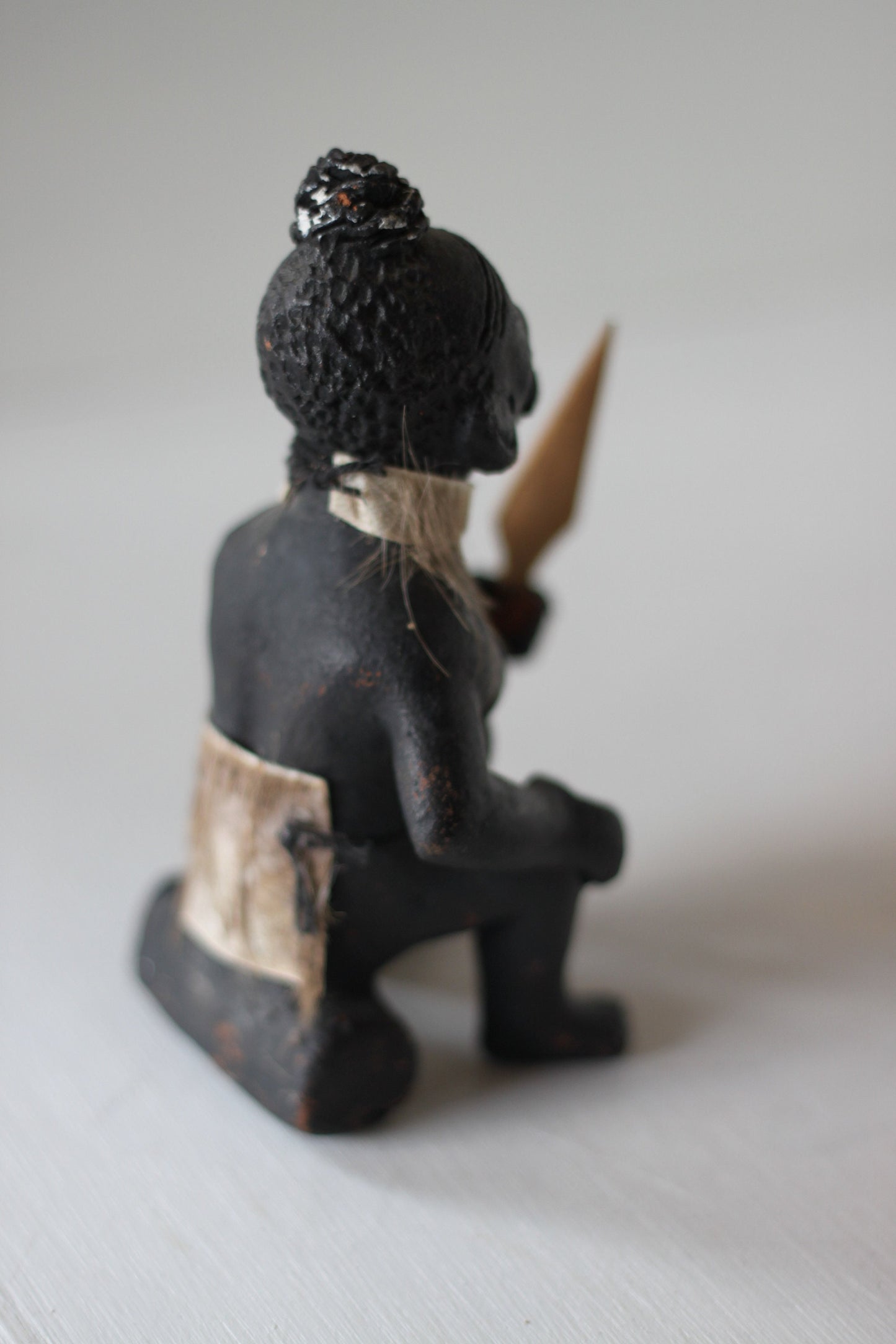 An Original Hand Made One Off Pottery Tribal Figurine in Traditional Dress and With Spear