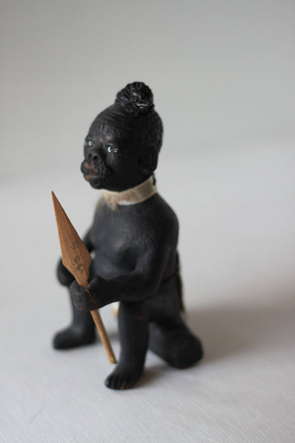 An Original Hand Made One Off Pottery Tribal Figurine in Traditional Dress and With Spear