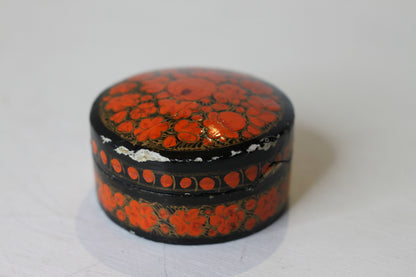 an Indian lacquered papier-mch box and cover hand painted with orange flowers