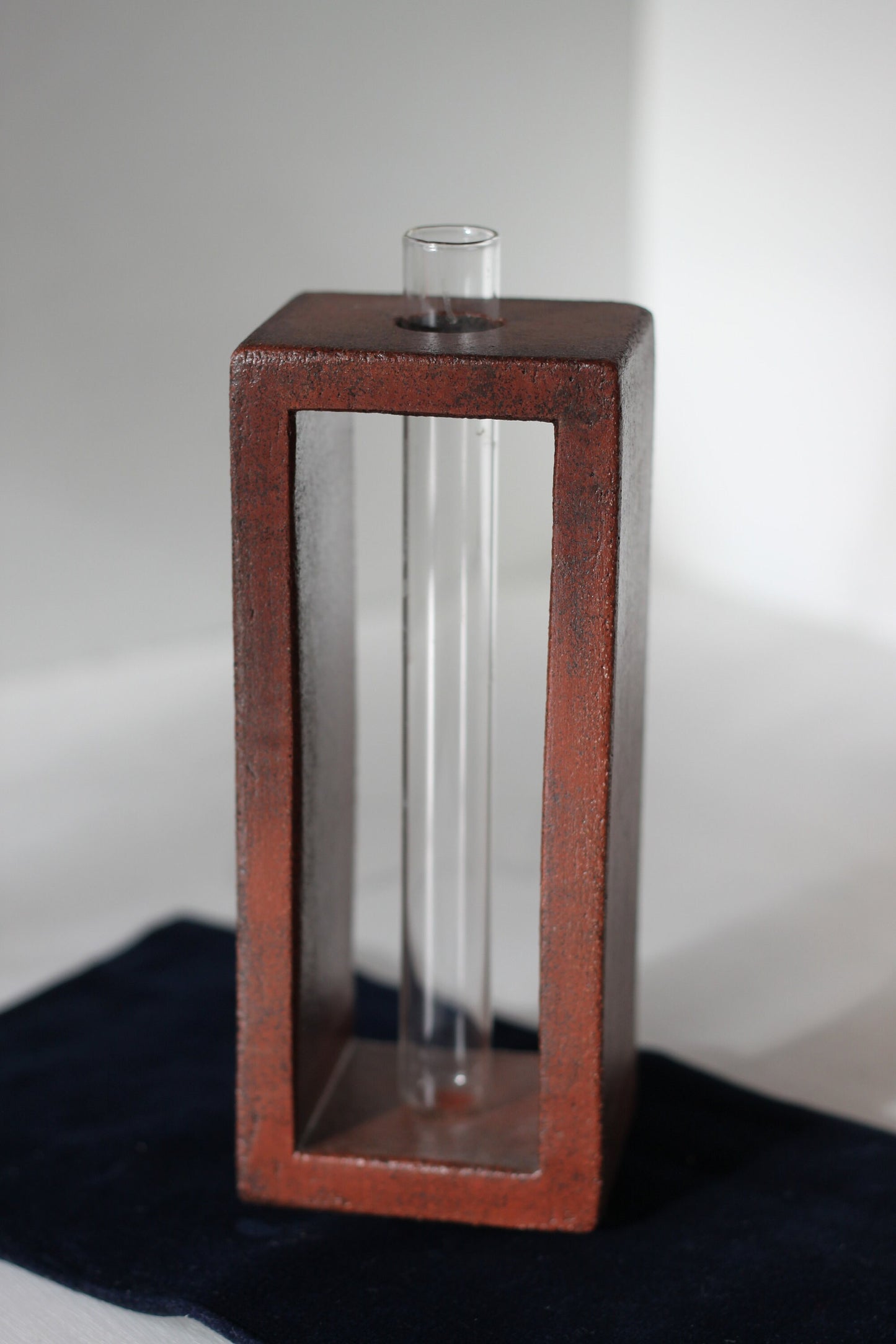 A Studio Pottery Glazed Brick-Form Test Tube Rack Vase