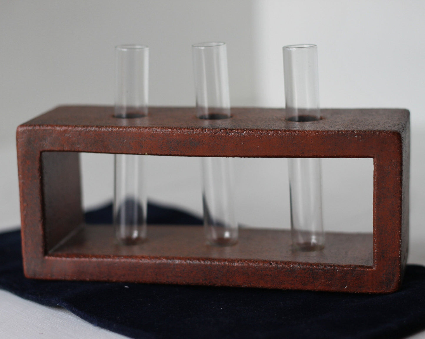 A Studio Pottery Glazed Brick-Form Test Tube Rack Vase