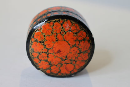 an Indian lacquered papier-mch box and cover hand painted with orange flowers