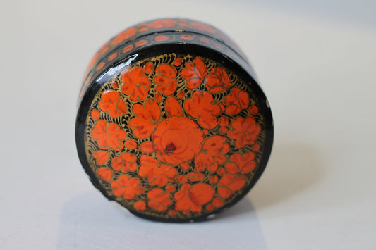 an Indian lacquered papier-mch box and cover hand painted with orange flowers