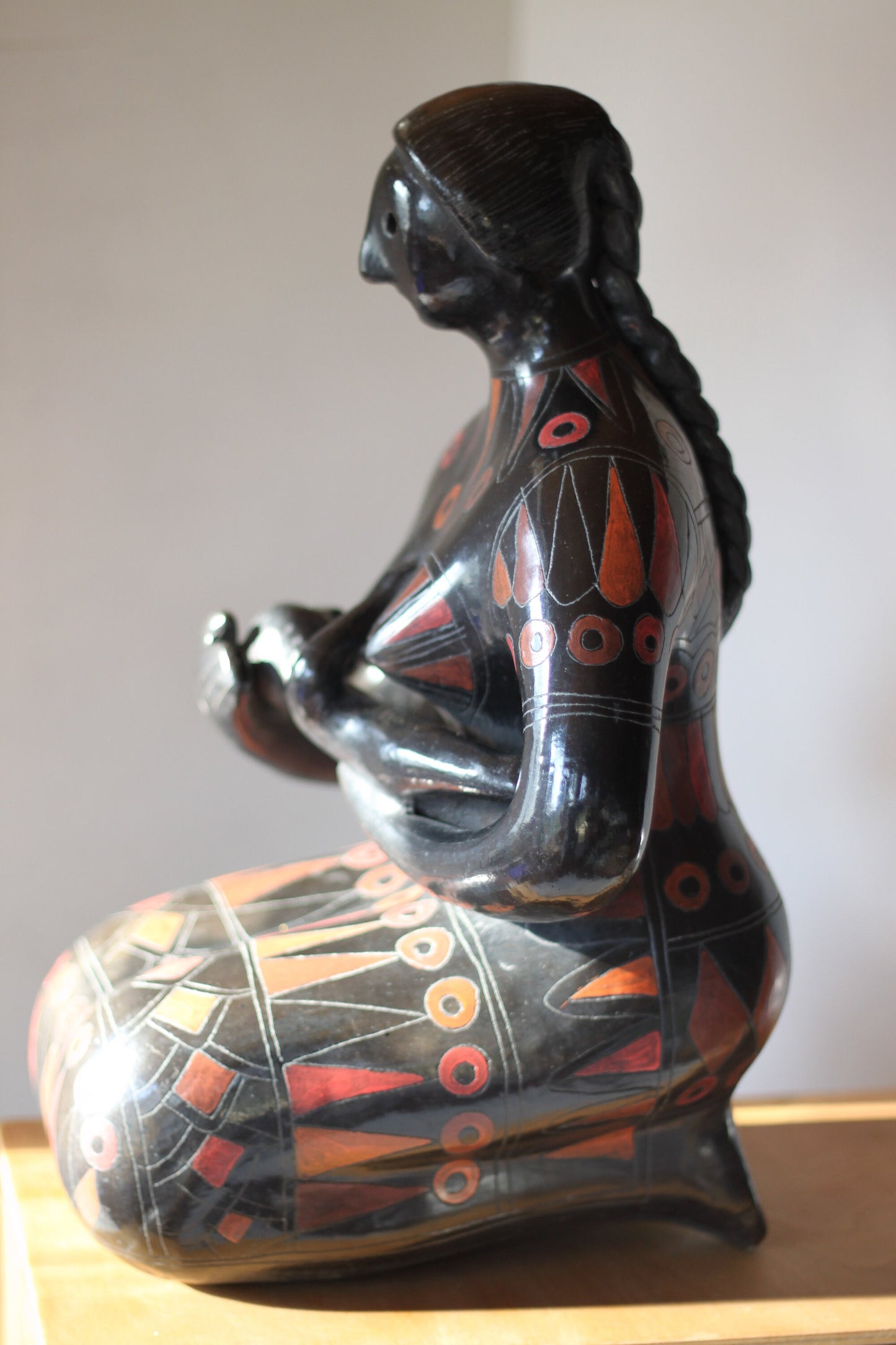 A Large Glazed Terracotta Blackware Sculpture of a Mother Figure Feeding Her Baby, in the manner of Manuel Felguerez , 39 cm's Tall