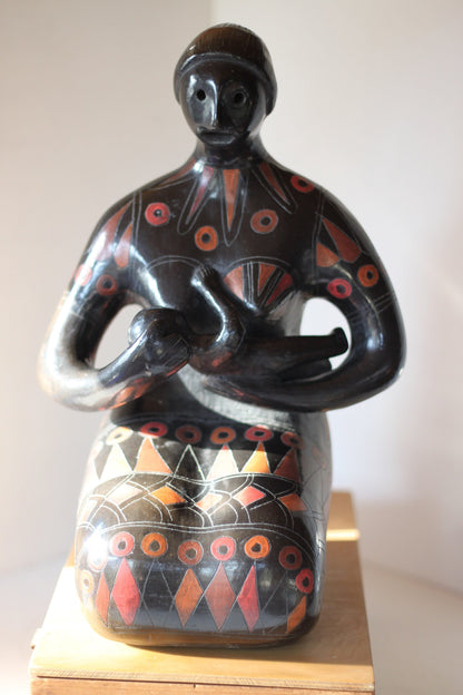 A Large Glazed Terracotta Blackware Sculpture of a Mother Figure Feeding Her Baby, in the manner of Manuel Felguerez , 39 cm's Tall