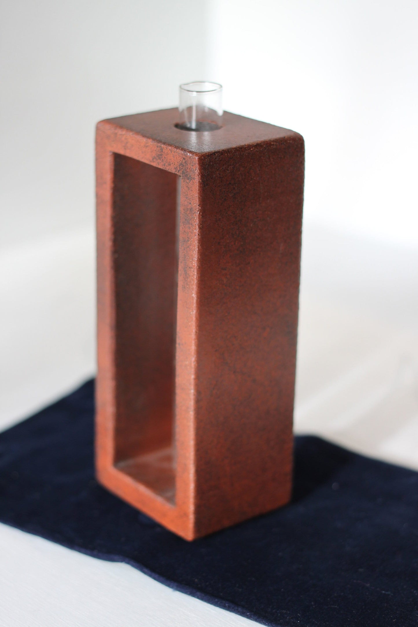 A Studio Pottery Glazed Brick-Form Test Tube Rack Vase