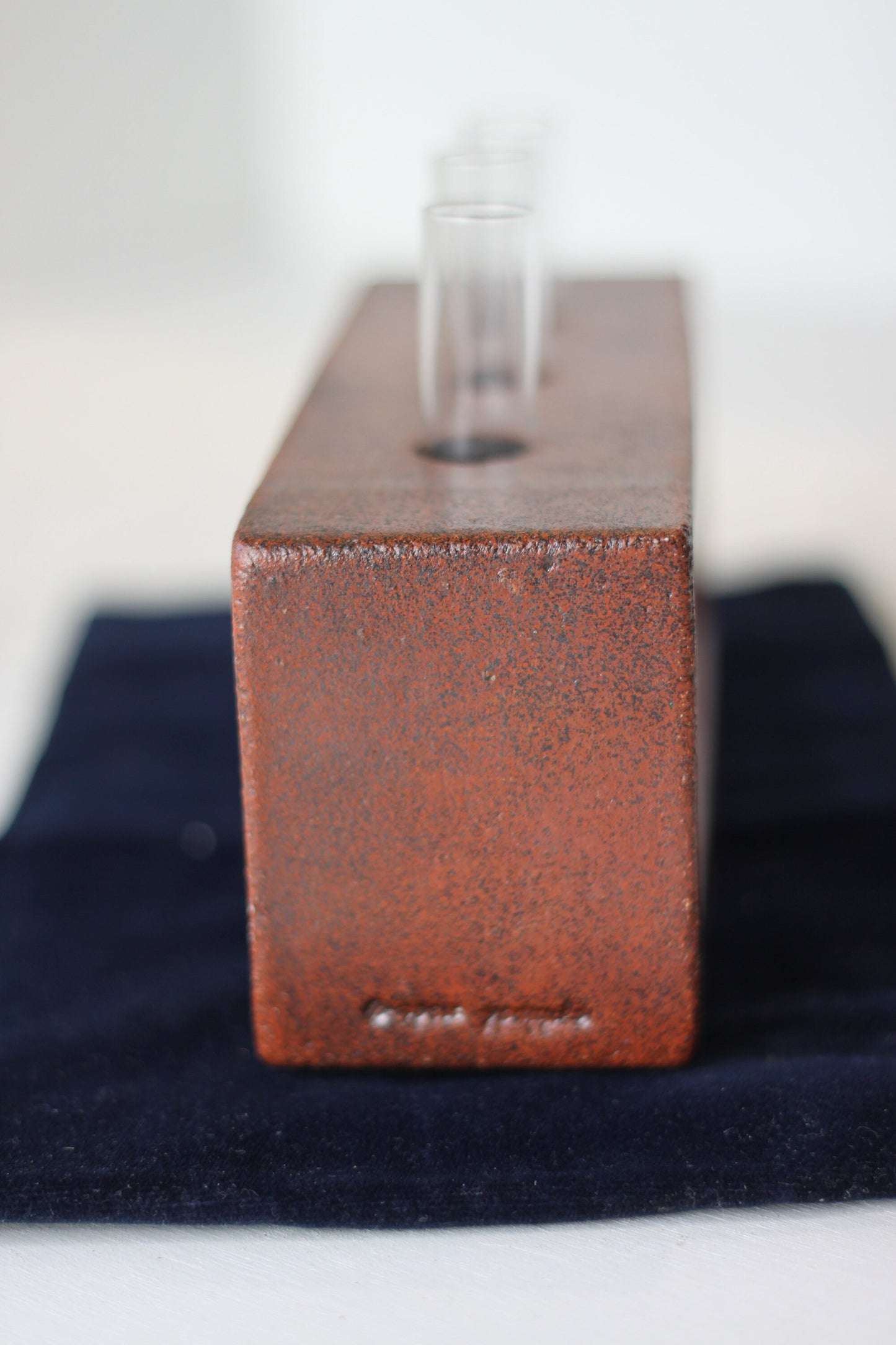 A Studio Pottery Glazed Brick-Form Test Tube Rack Vase