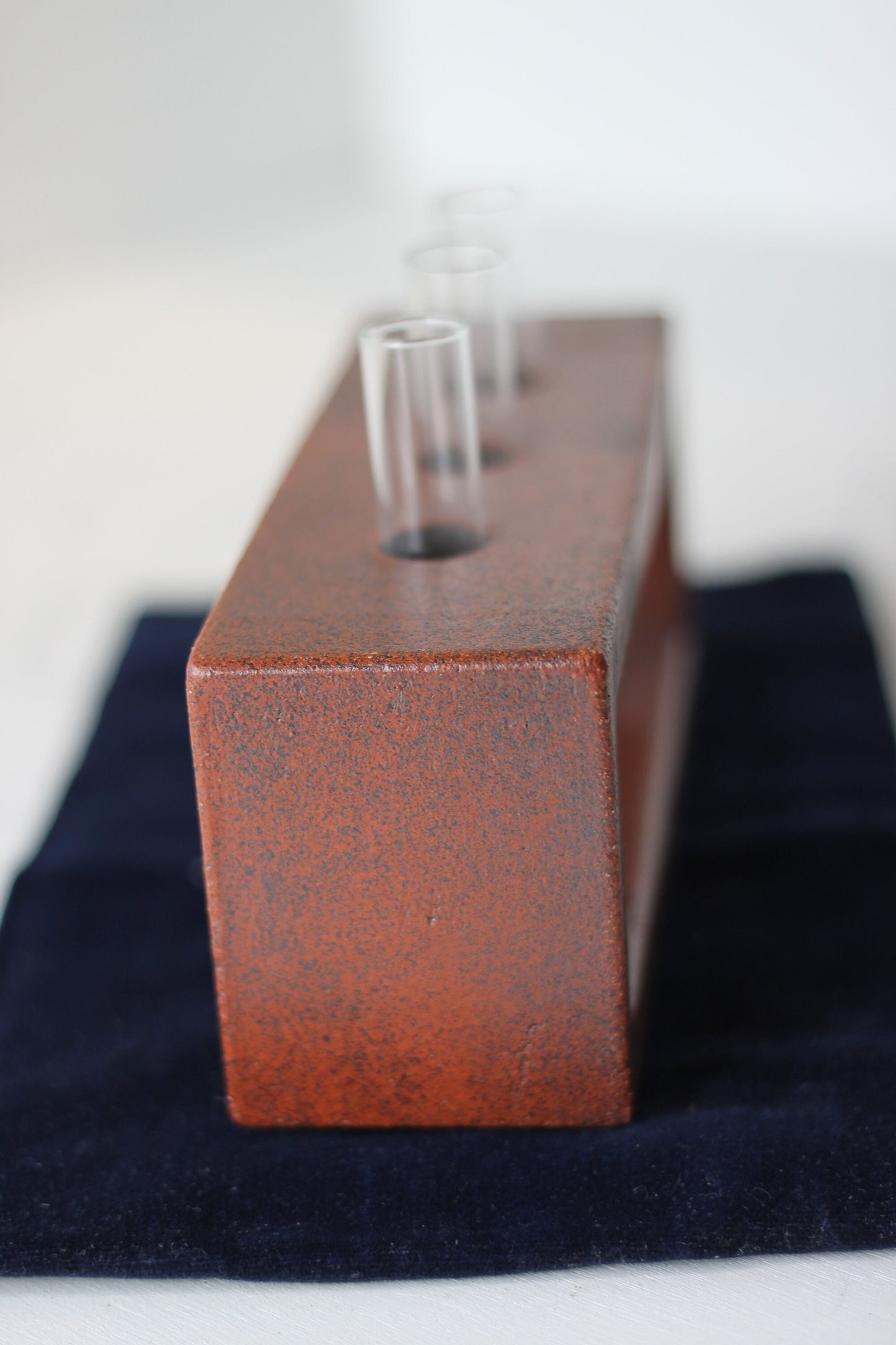 A Studio Pottery Glazed Brick-Form Test Tube Rack Vase