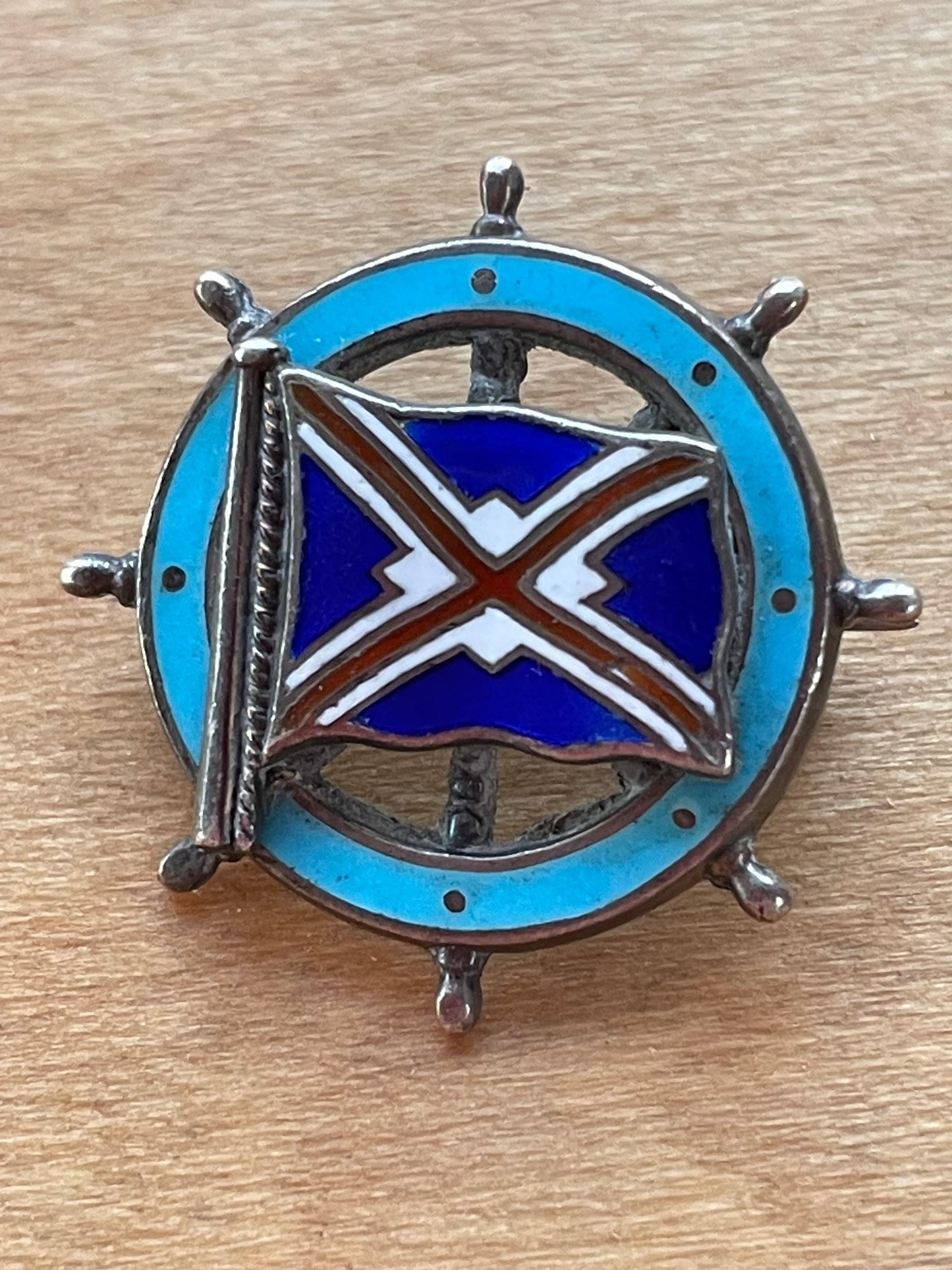 A Solid Silver and Enamel Pin Badge -Union-Castle Shipping Line Ships Wheel Badge Made in Southall,  Birmingham 1909 by Michael Emanuel