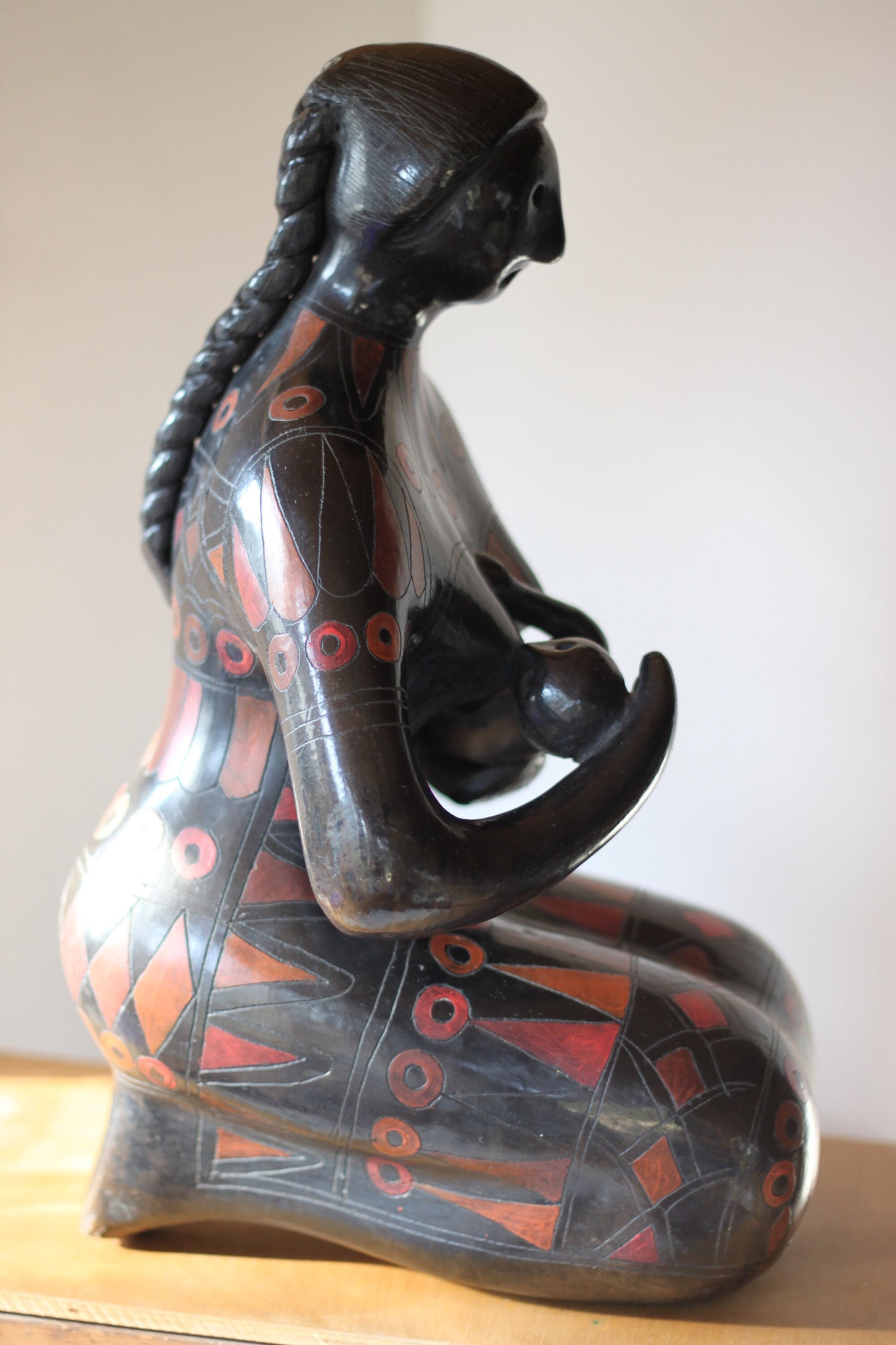 A Large Glazed Terracotta Blackware Sculpture of a Mother Figure Feeding Her Baby, in the manner of Manuel Felguerez , 39 cm's Tall