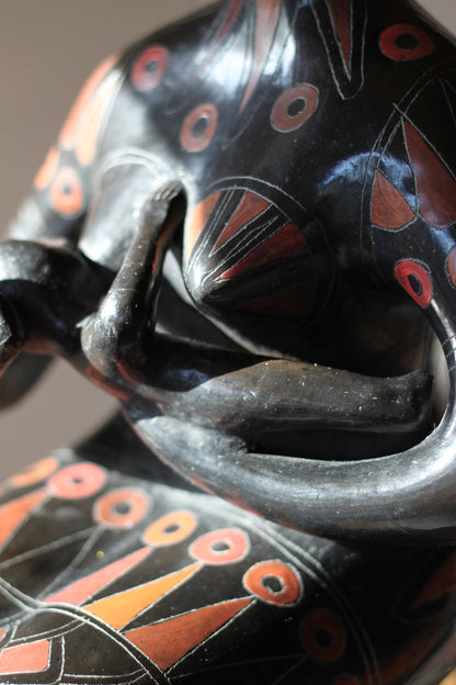 A Large Glazed Terracotta Blackware Sculpture of a Mother Figure Feeding Her Baby, in the manner of Manuel Felguerez , 39 cm's Tall