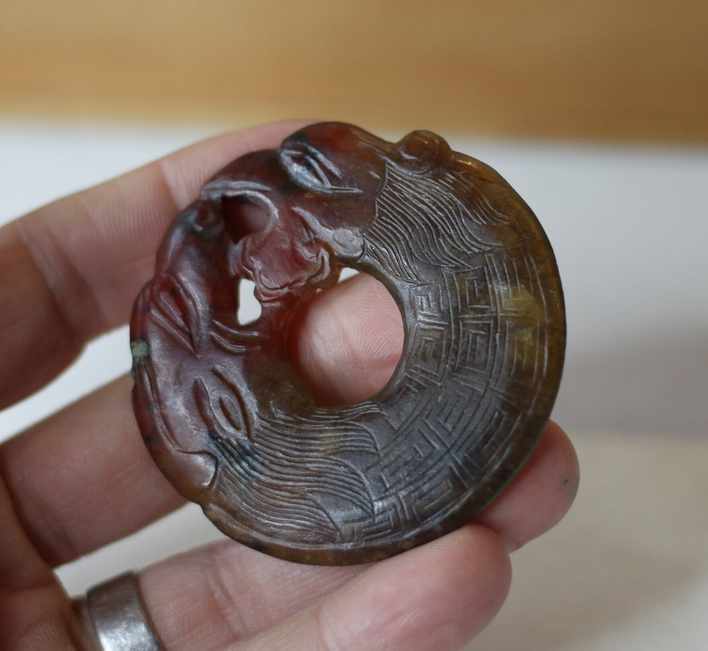 A Chinese Red Hardstone Bi Disc/Pendant  6.5cm Across