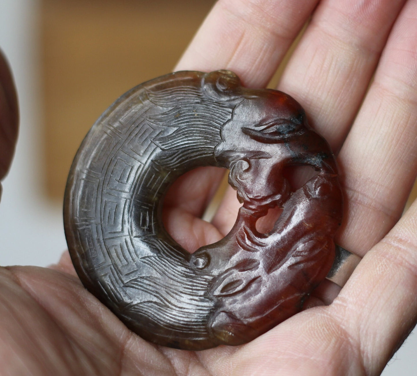 A Chinese Red Hardstone Bi Disc/Pendant  6.5cm Across