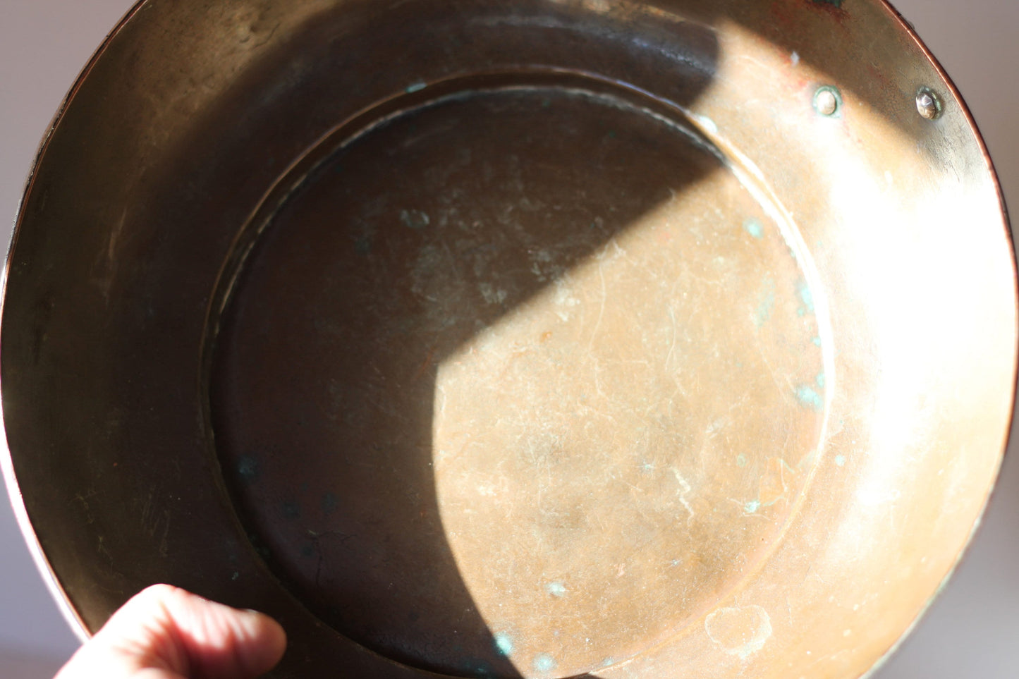 A Hand Made Tibetan Copper Bowl With Single Decorative Silver (white metal) Handle and Rim