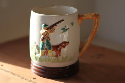 A country scene mug with a game farmer and his dog