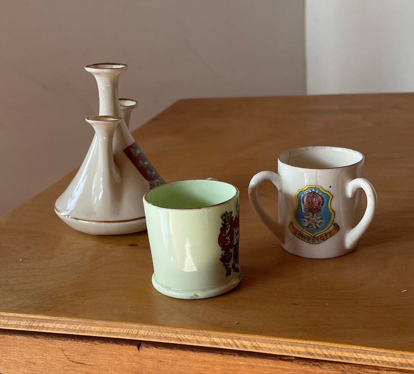 Three Crest Ware Pieces From Places Around The UK - Great Yarmouth Jug, Triple Handled Norwich and Lowestoft Beaker and a Croydon Beaker