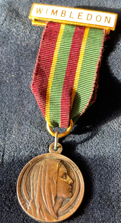 A Pendant Fob charm of - "Our Lady of Lourdes" forming a  WIMBLEDON medal likely from Wimbledon College  by H W Miller Birmingham