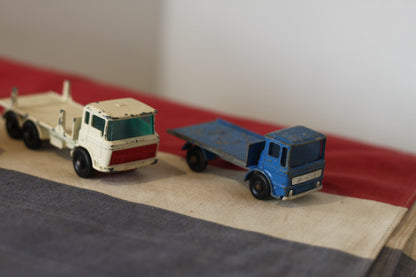 Four Diecast Metal Matchbox Lesney and Husky Toy Trucks From The 1960's