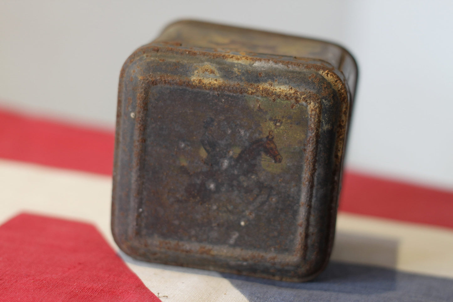 A late Victorian Antique Lithographed Tin From 'Moss Rimmington Ltd Mustard Barco and Baking Powder' Decorated With Horses and Riders