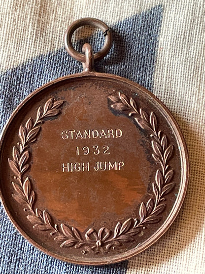 A medallion Fob for the Police Athletic Association Championship Standard 1932 High Jump