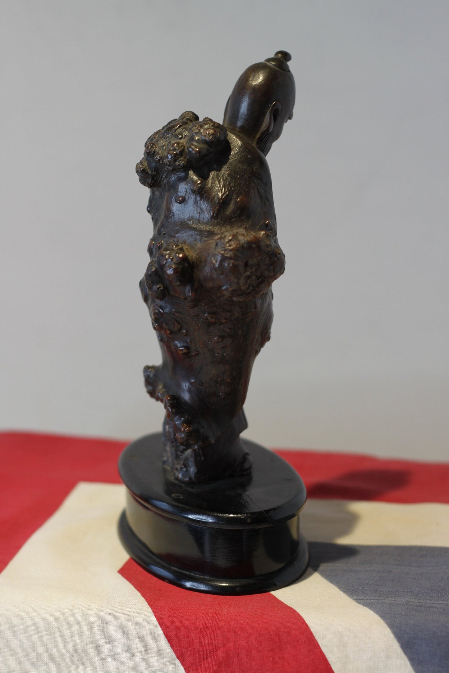 A Chinese Root Wood Hand Carving of an Elder Raised on a Later Oval Ebony Base, Overall 23.5cm High